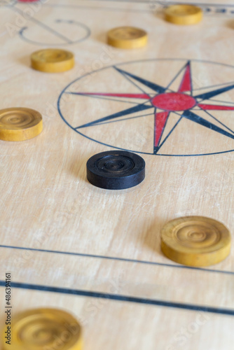 Carrom is a tabletop game of South Asian origin. Carrom is very commonly played by families, including children, and at social functions.