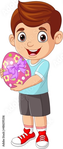 Cartoon little boy holding an easter egg