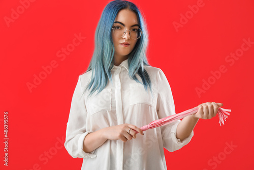 Young woman with whip from ...