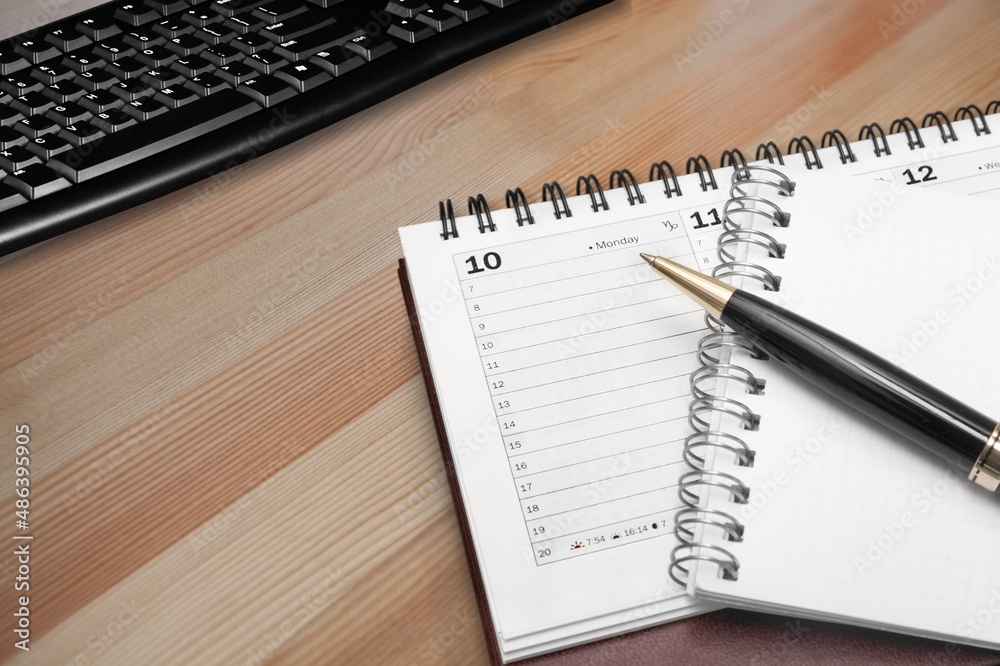 The 2022 desk calendar with pencil on office desk background. The 2022 desk calendar with pencil on office desk background.