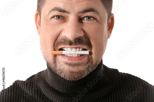 Man with cigarette in mouth isolated on white