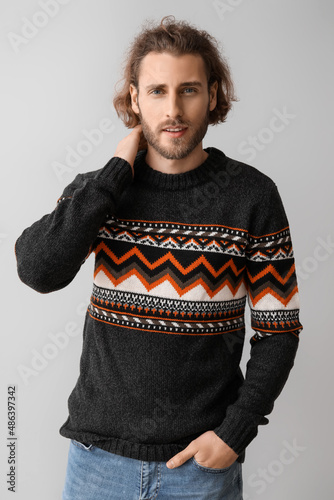 Handsome young man in knitt...