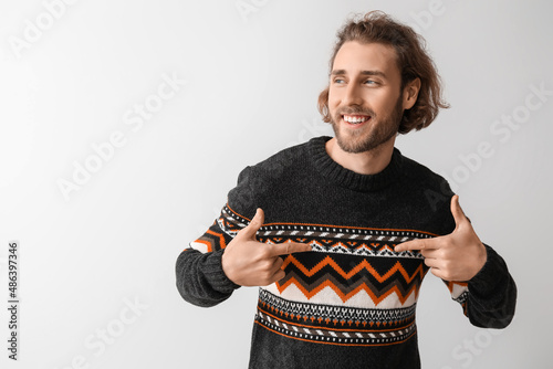 Handsome young man in knitt...