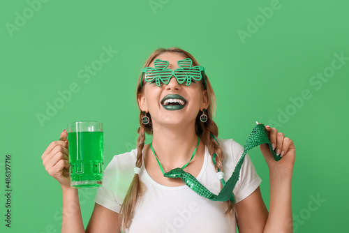 Young woman with glass of b...