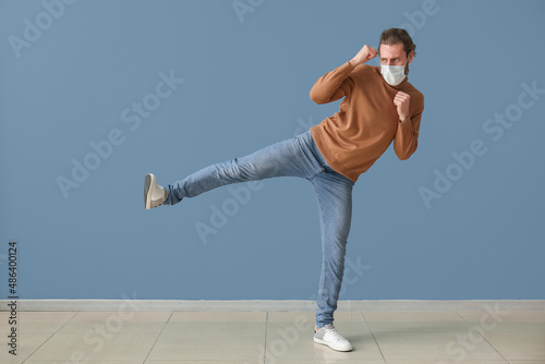 Young male kickboxer wearin...