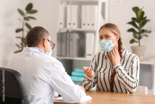 Ill woman with sore throat ...