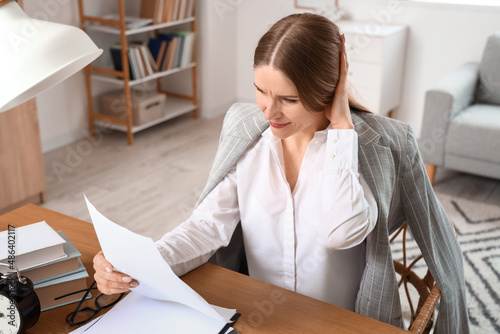 Worried businesswoman with ...