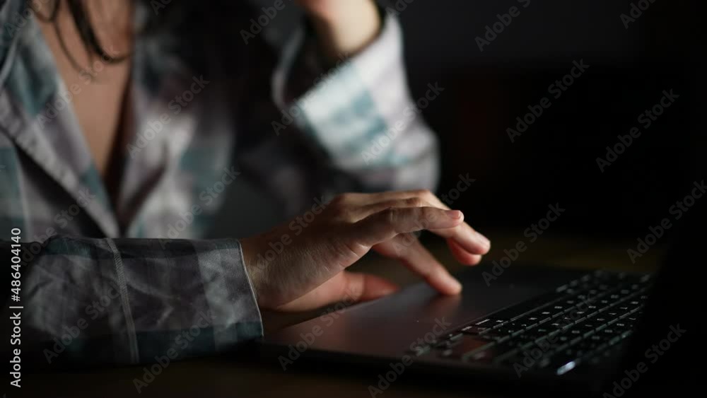 Person hand browsing internet using laptop close-up hand