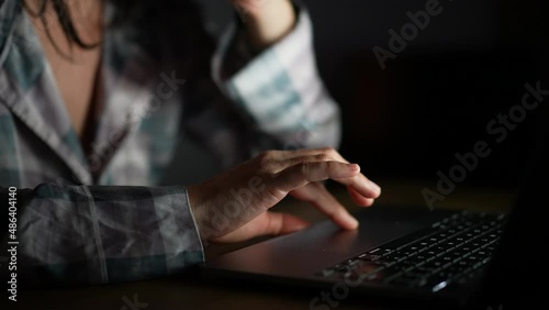 Person hand browsing internet using laptop close-up hand