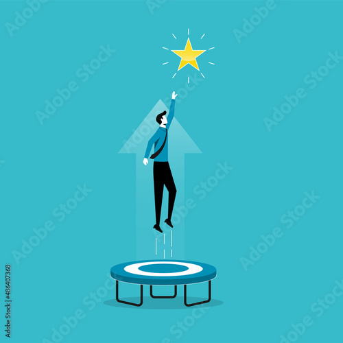 Businessman jumping from trampoline to reach out the star