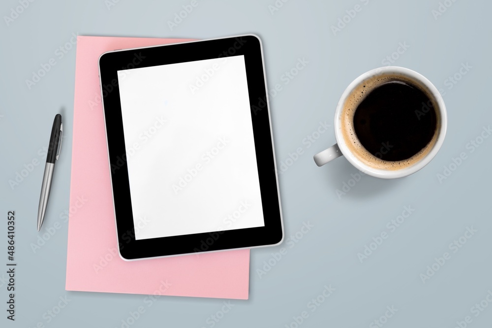 tablet computer with a cup of tea or coffee. concept business or to do list goals tablet computer with a cup of tea or coffee. concept business or to do list goals
