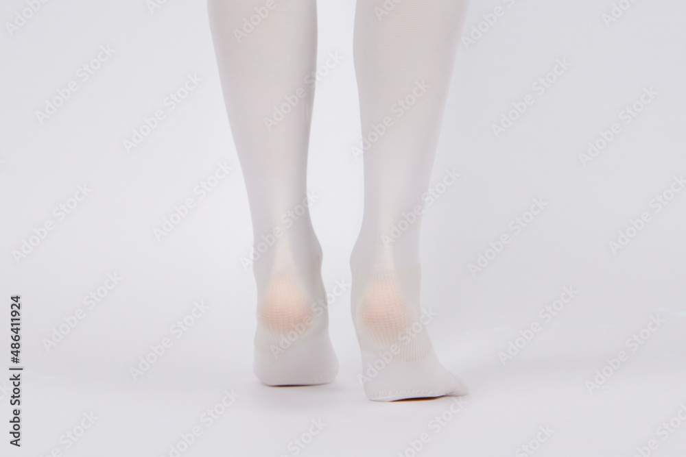 Anti-embolic Compression Hosiery for surgery isolated on white. Medical white stockings, tights for varicose veins and venouse therapy. Thrombo embolic deterrent hose or anti-embolism stockings. Anti-embolic Compression Hosiery for surgery isolated on white. Medical white stockings, tights for varicose veins and venouse therapy. Thrombo embolic deterrent hose or anti-embolism stockings.