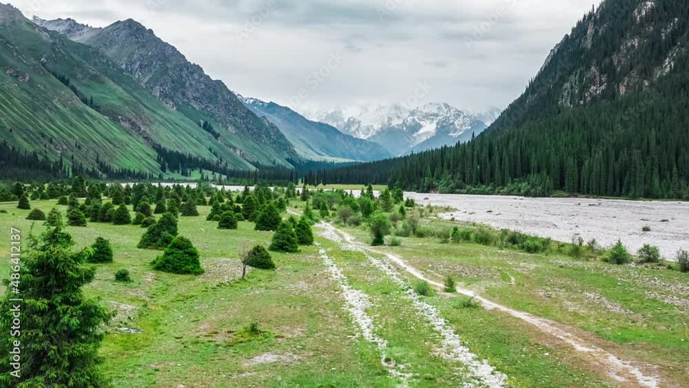 Aerial shot of majestic mountain and green forest natural landscape in Xinjiang, China. Aerial shot of majestic mountain and green forest natural landscape in Xinjiang, China.