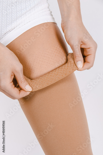 Compression Hosiery. Medical Compression stockings and tights for varicose veins and venouse therapy. Socks for man and women. Clinical compression knits. Comfort maternity tights for pregnant women. photo