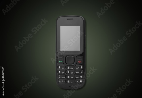 Wallpaper Mural Old retro mobile phone on dark background Torontodigital.ca