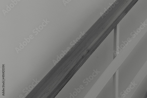concrete wall background, gray​ wooden​ barustrade​ ​on​ white​ iron barustrade​