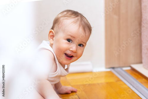 Cute little boy plaing on floor and have fun