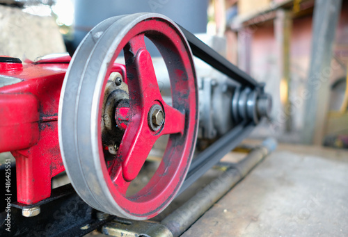 Close up shot of driven pulley of an electric motor water pump