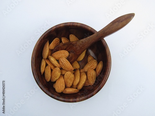 Almonds in a wooden bowl bowl on 