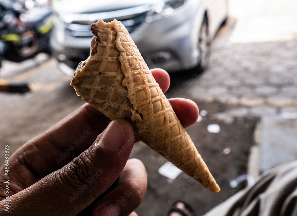 partially bitten ice cream cone
partially bitten ice cream cone