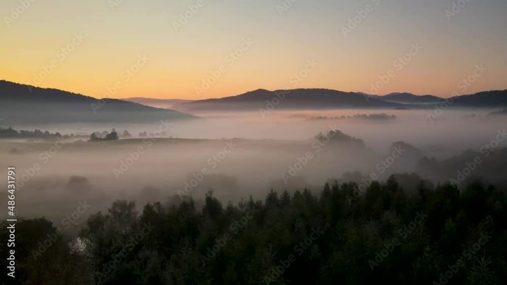 Aerial shot of misty mountains just before sunrise Aerial shot of misty mountains just before sunrise