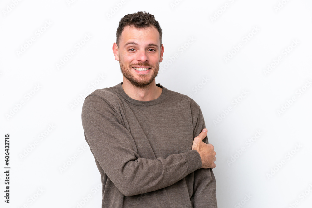 Young Brazilian man isolated on white background laughing