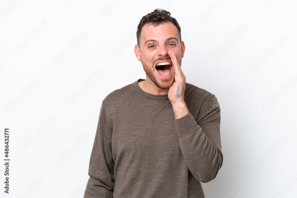 Young Brazilian man isolated on white background with surprise and shocked facial expression Young Brazilian man isolated on white background with surprise and shocked facial expression