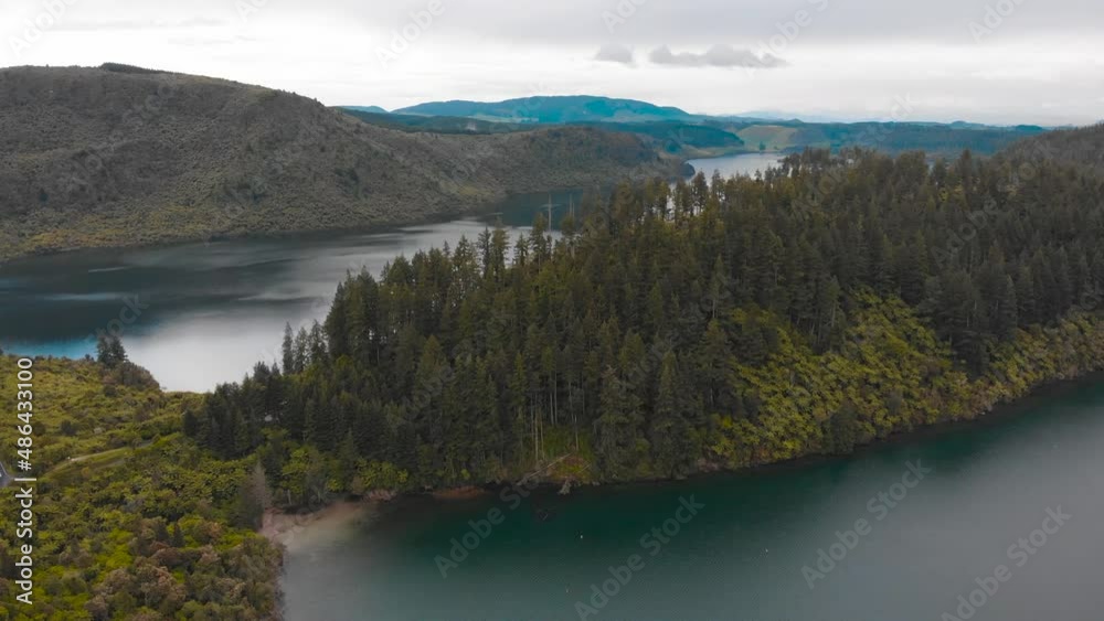 The drone flies over the forest and lake in Whakarewarewa Forest Park The drone flies over the forest and lake in Whakarewarewa Forest Park
