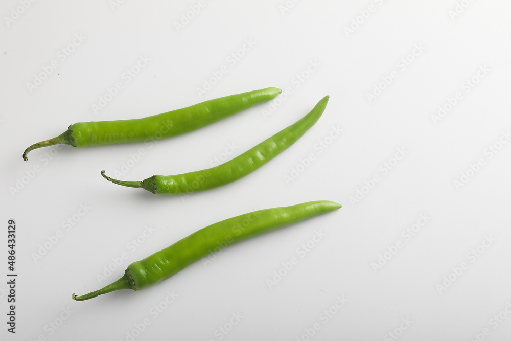 Fresh green chili on white background. Fresh green chili on white background.