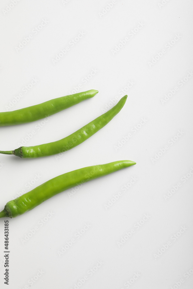 Fresh green chili on white background. Fresh green chili on white background.