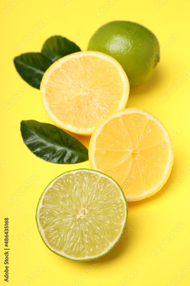 Concept of tasty food with citrus fruits on yellow background Concept of tasty food with citrus fruits on yellow background