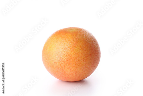 One whole grapefruit isolated on white background
