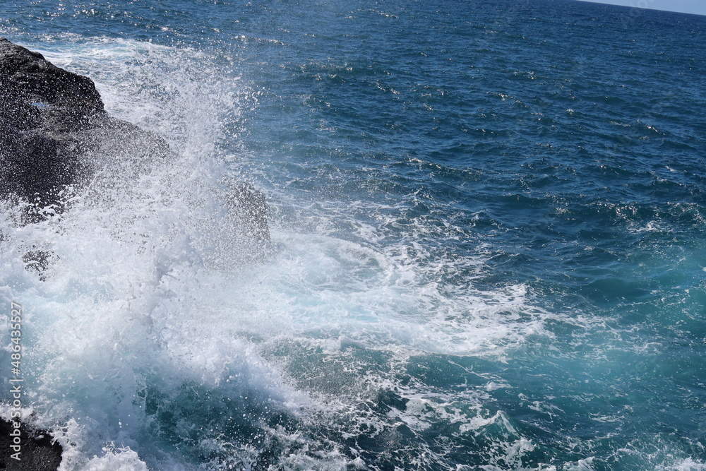 waves crashing on rocks