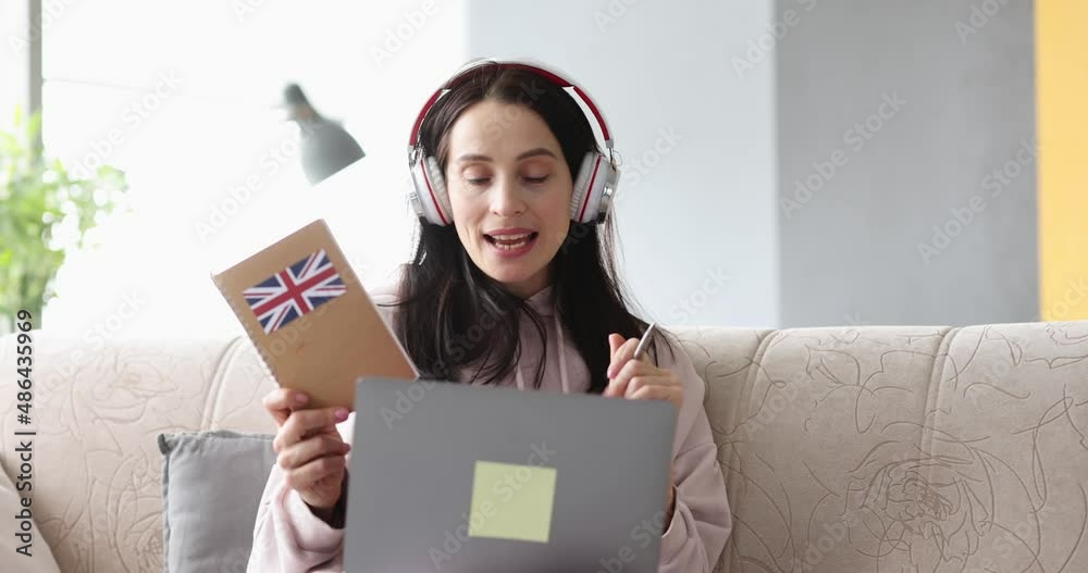 Smiling woman being assessed english remotely at home closeup Smiling woman being assessed english remotely at home closeup