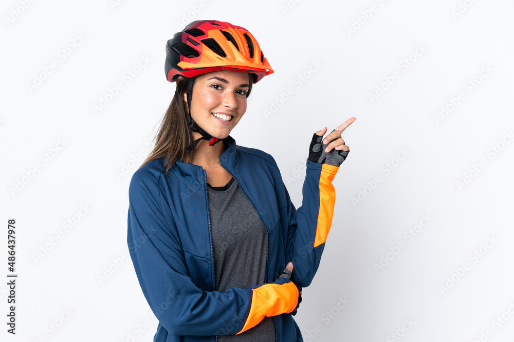 Young cyclist brazilian girl isolated on white background pointing finger to the side Young cyclist brazilian girl isolated on white background pointing finger to the side