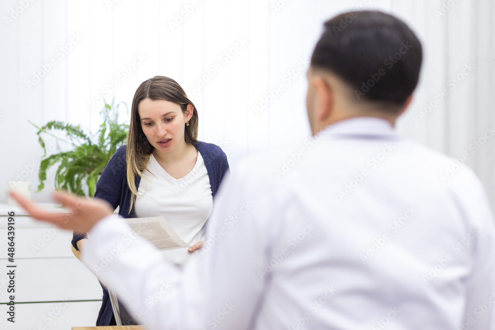Photo of pregnant woman visiting her doctor. Photo of pregnant woman visiting her doctor.