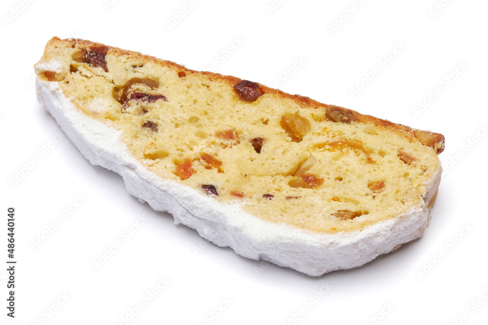 Slices of Traditional Christmas stollen cake with marzipan and dried fruit isolated on white background Slices of Traditional Christmas stollen cake with marzipan and dried fruit isolated on white background