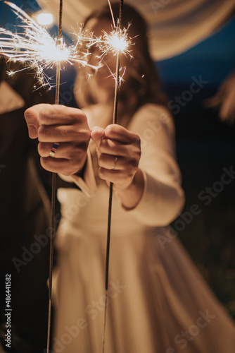 Wedding pair with sparklers in hands 