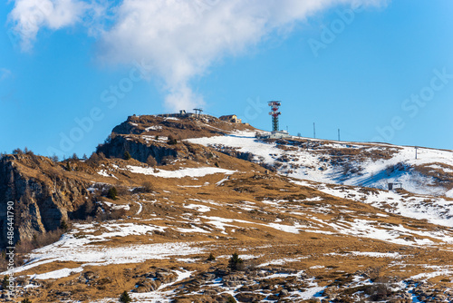 Peak of Castel Gaibana (1806 m) and Malga San Giorgio Ski Resort in winter, Lessinia Plateau Regional Natural Park (Altopiano della Lessinia), Bosco Chiesanuova, Verona, Veneto, Italy, Europe.