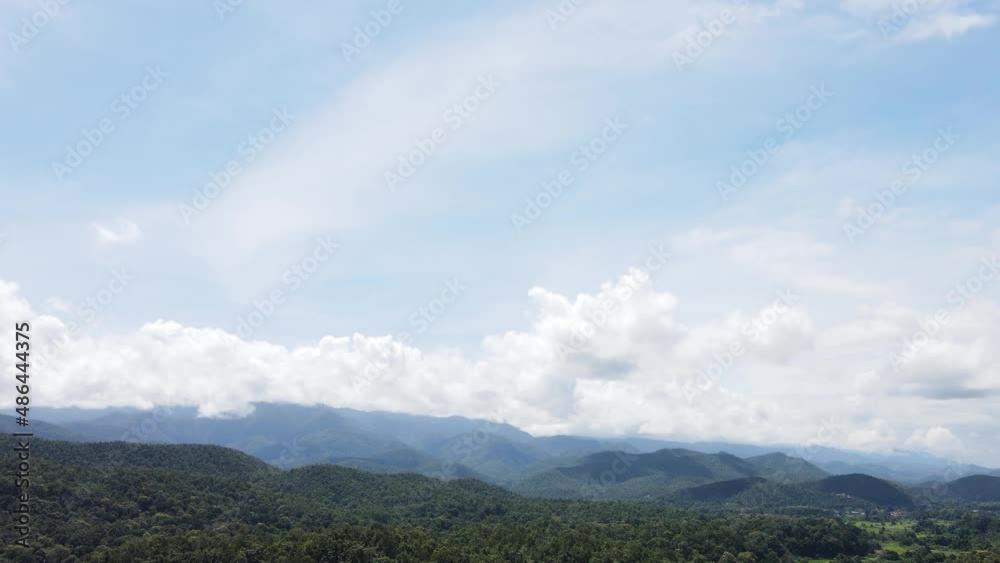 Panorama view many green mountains cover the sky. Fluffy clouds on the horizon on a hot day. Phu Thap Boek ,Thailand. Panorama view many green mountains cover the sky. Fluffy clouds on the horizon on a hot day. Phu Thap Boek ,Thailand.