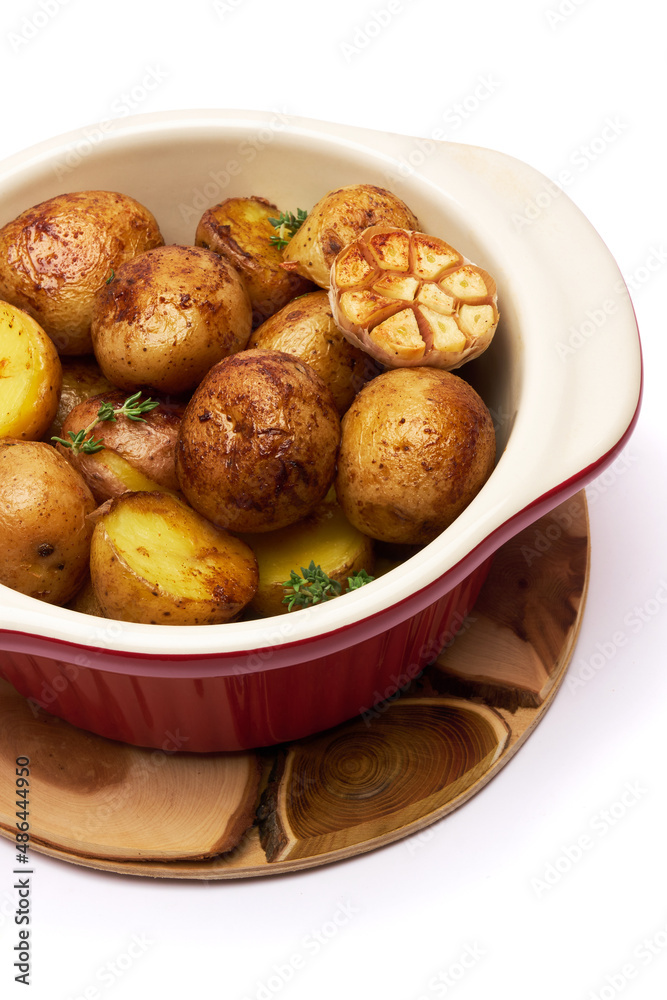Baked potato in a clay pot isolated on white background Baked potato in a clay pot isolated on white background