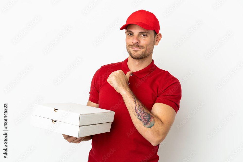 pizza delivery man with work uniform picking up pizza boxes over isolated white wall proud and self-satisfied pizza delivery man with work uniform picking up pizza boxes over isolated white wall proud and self-satisfied
