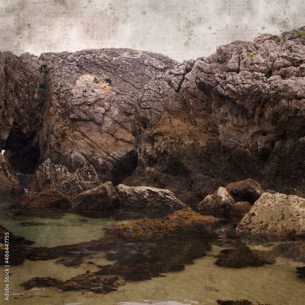 stylish textured old paper square background with landscape of coastal part of Cantabria called Costa Quebrada, the Broken coast
