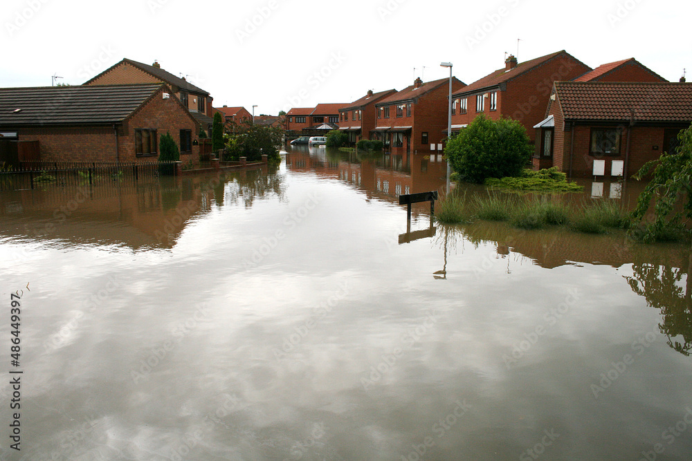 Fototapeta premium flood disaster zone, flooded houses and streets, flash flooding extreme weather 