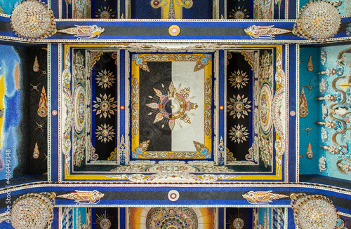 Bangkok, Thailand. Feb - 10, 2022 : Elaborate sculptures on Ceiling inside the Buddhist church at the famous of The Pariwas Ratchasongkram temple. Selective Focus. photo