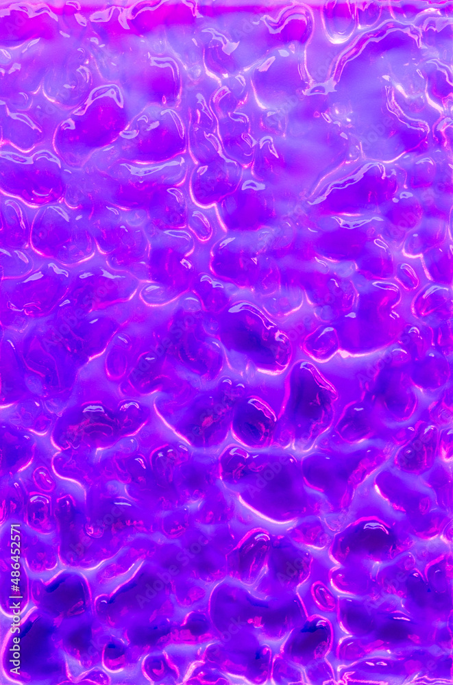 Abstract wavy surface with neon magenta and violet hues. Futuristic liquid bacground.