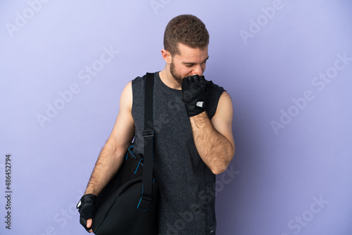 Young sport man with sport bag isolated on white background having doubts