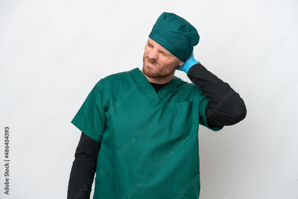 Surgeon Brazilian man in green uniform isolated on white background with neckache Surgeon Brazilian man in green uniform isolated on white background with neckache