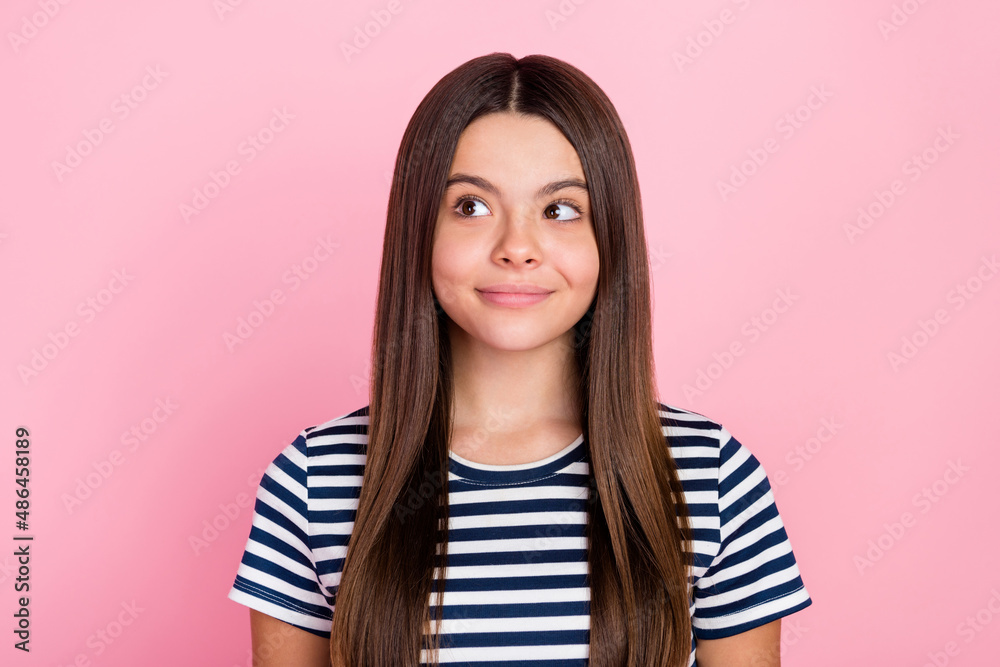 Photo of shiny pretty girl dressed striped clothes looking empty space smiling isolated pink color background Photo of shiny pretty girl dressed striped clothes looking empty space smiling isolated pink color background