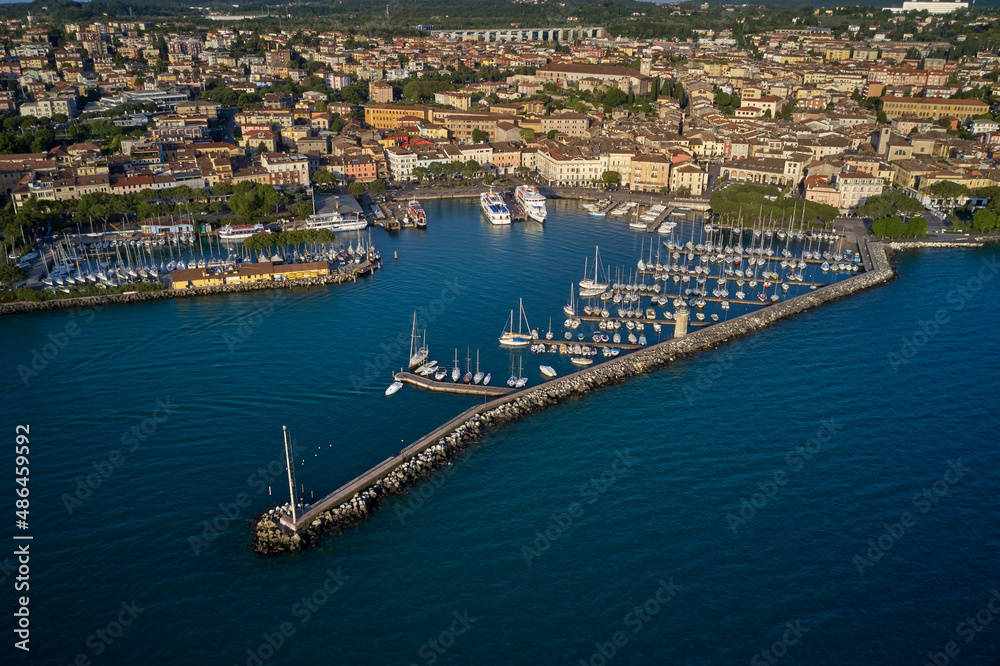 Fototapeta premium Italian resorts on Lake Garda. Porto vecchio in Desenzano del Garda, Italy. Desenzano, lago di Garda view by drone. Desenzano del Garda in italy. 